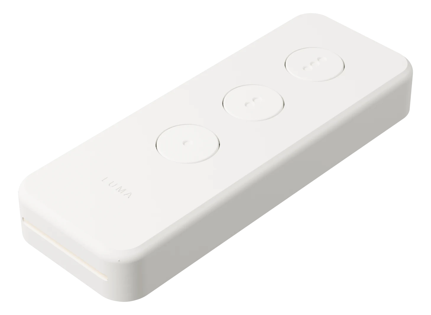 An ivory Luma Remote Air with three round, dot-marked keys, suspended in open space